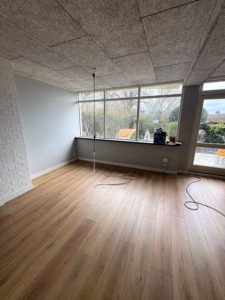 After: the same room with the finished wooden floor