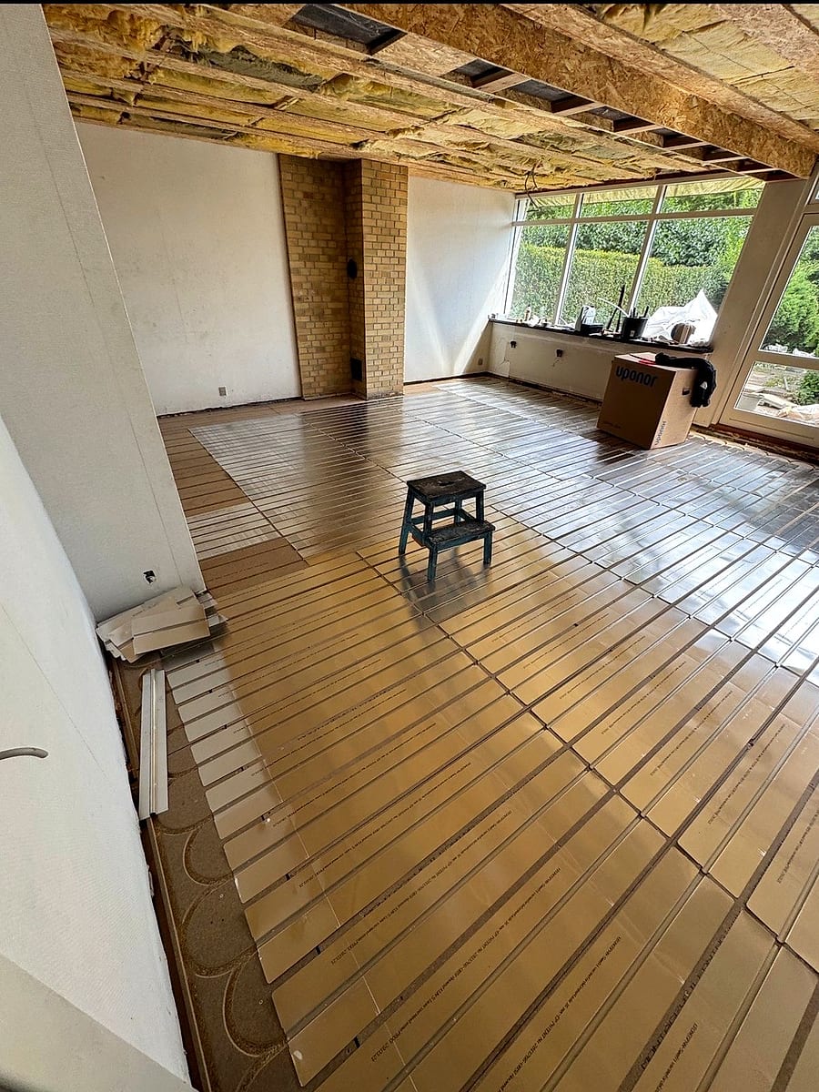 Before: the room with underfloor heating plates, before the floor was laid